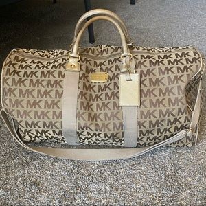Michael kors gold logo duffle bag